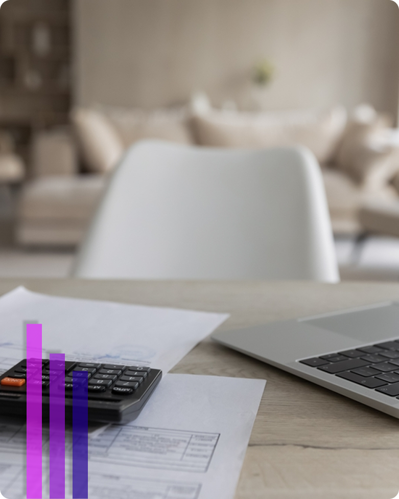 Office setup with a laptop and a calculator on the desk