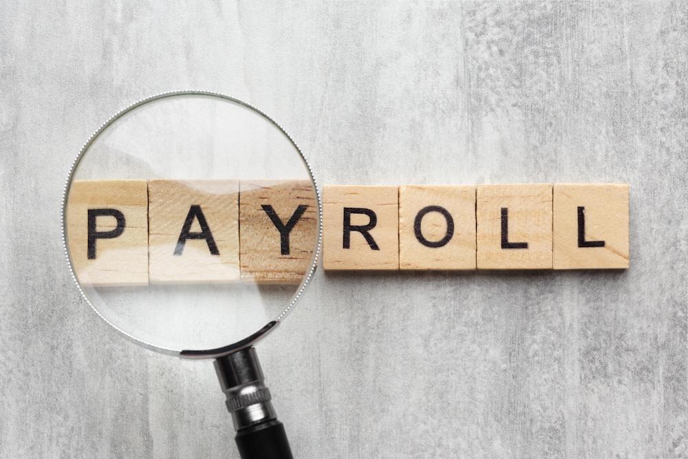 top view payroll concept with wooden cubes